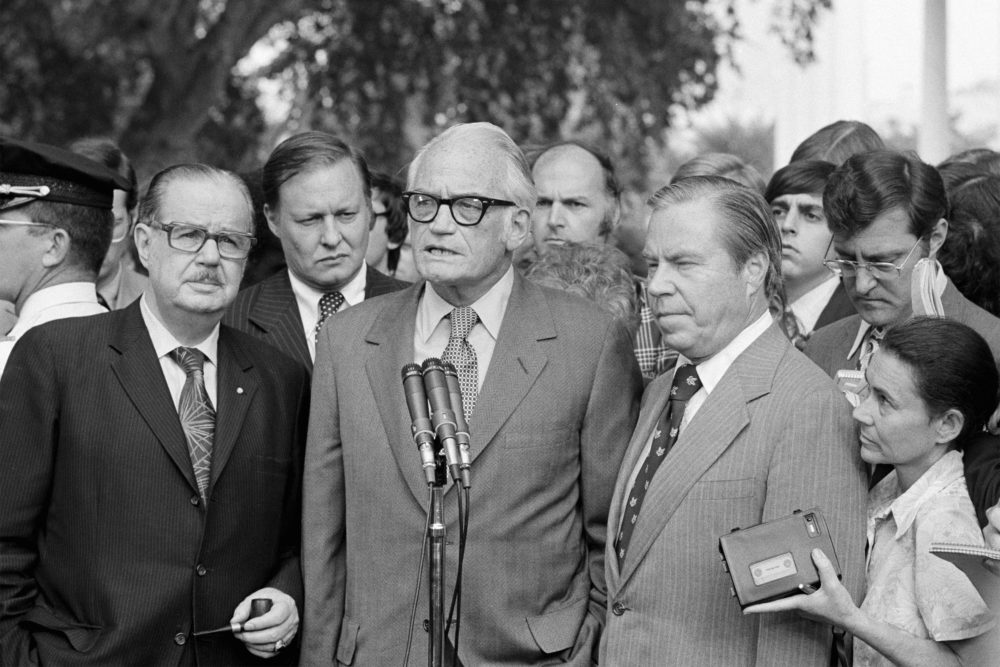 In this Aug. 7, 1974 file photo, Sen. Barry Goldwater, R-Ariz., center, speaks to reporters after meeting with President Richard Nixon at the White House to discuss Nixon's decision on resigning. He is flanked by Senate Republican Leader Hugh Scott of Pennsylvania, left and House GOP Leader John Rhodes of Arizona, right. The three top Republican leaders in Congress paid a solemn visit to Nixon, bearing the message that he faced near-certain impeachment due to eroding support in his own party. Nixon announced his resignation the next day. (AP)