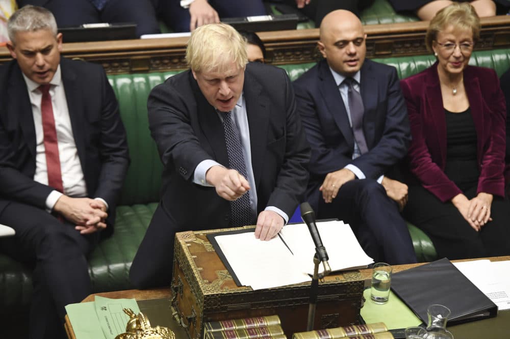 Britain's Prime Minister Boris Johnson speaks to lawmakers inside the House of Commons to update details of his new Brexit deal with EU, in London Saturday Oct. 19, 2019. (Jessica Taylor/House of Commons via AP)