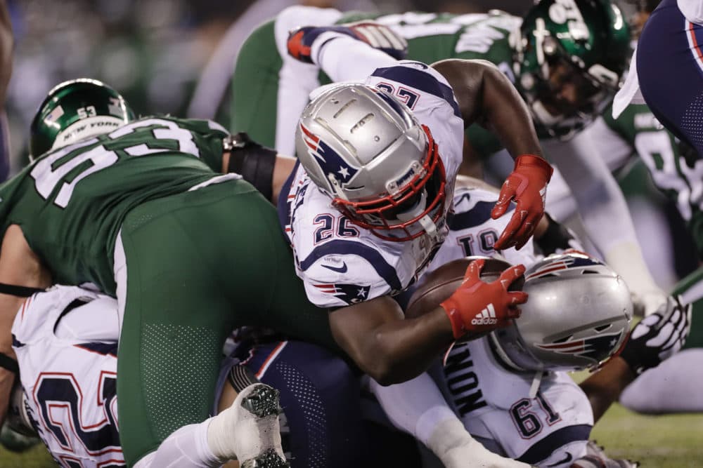 Patriots' Sony Michel (26) dives for a touchdown during the second half of the game. (Adam Hunger/AP)