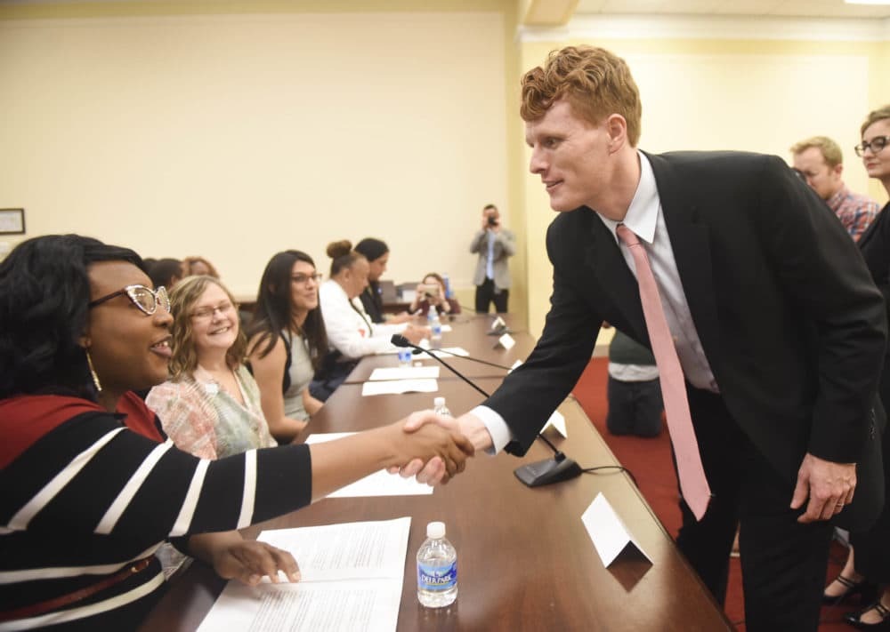 Rep. Joe Kennedy III shakes hands with LaLa Zannell at the Congressional Forum on Violence Against the Transgender Community on Nov. 17, 2015. (Kevin Wolf/AP Images for Human Rights Campaign)