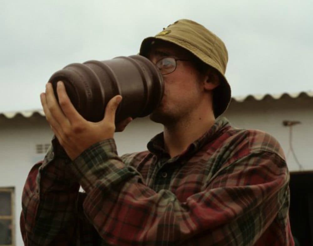 The author drinking Zimbabwean beer. (Courtesy)