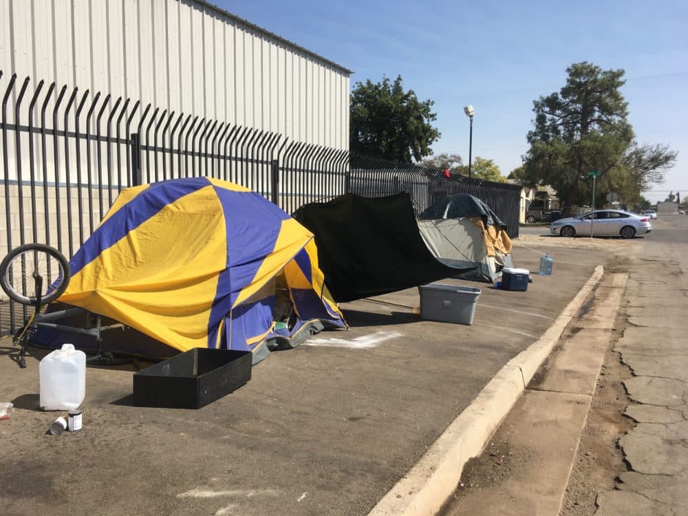 A street lined with tents in Bakersfield, California. (Alex Ashlock/Here & Now)