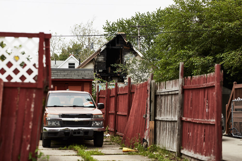Properties with severe damage are often fast-tracked to the demolition process due to risks to the community. This house appears to be in good shape from the facade, but the view from the back shows a fire has gutted the structure. (Paul Sobota/Here & Now)