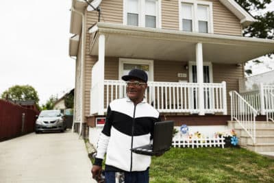 Archie Morris in front of his well kept home. (Paul Sobota/Here & Now)