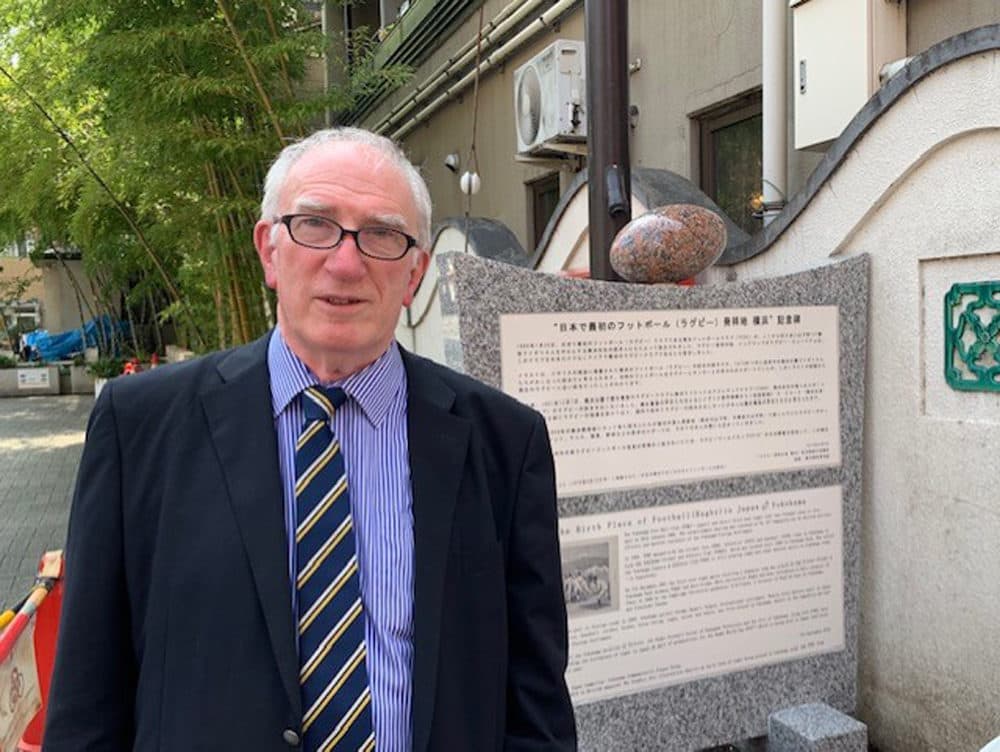 Historian Mike Galbraith by the plaque recognizing Yokohama's rugby history. (Courtesy Mike Galbraith)