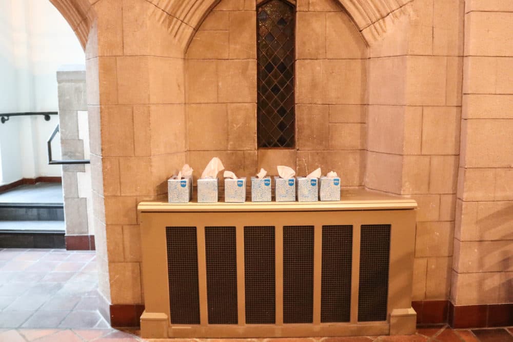 Tissues line a wall at a death cafe inside Bigelow Chapel at Mount Auburn Cemetery. (Olivia Deng for WBUR)