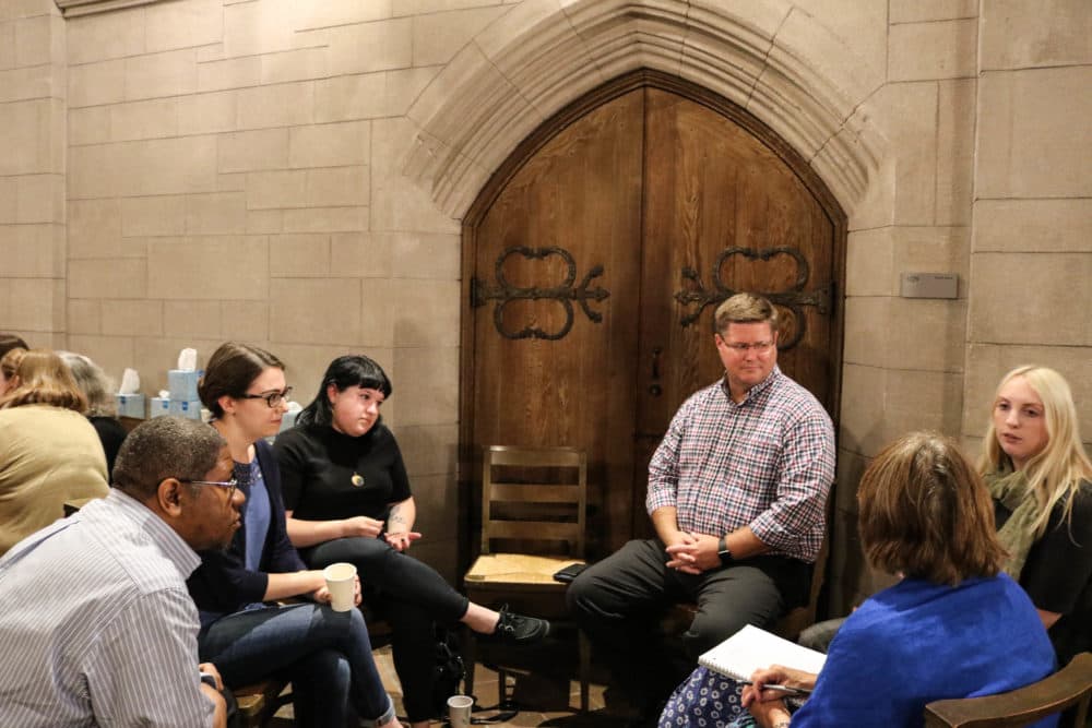 At a death cafe inside Bigelow Chapel at Mount Auburn Cemetery, people gather to enjoy cake and tea while discussing death and mortality in a safe space. (Olivia Deng for WBUR)