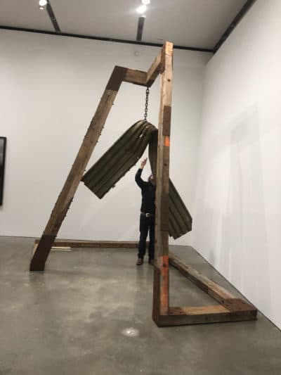 Artist Guillermo Galindo plays his sonic device called "Angel Exterminator." (Cristela Guerra/WBUR)