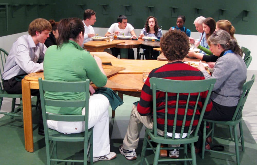 Trinity Church members sitting at Harries' "One-Legged Table." (Courtesy)