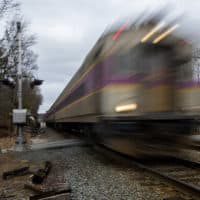 An MBTA Commuter Rail train on the Haverhill line travels through Andover. (Jesse Costa/WBUR)