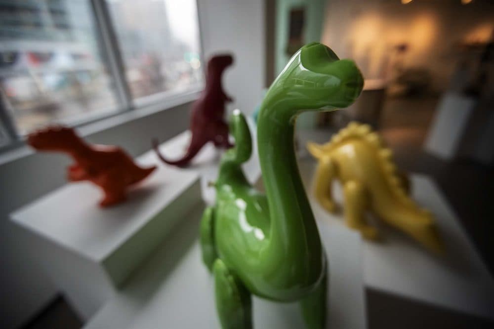 Brett Kern's assorted dinosaurs featured in "Child's Play" at the Society of Arts + Crafts. (Jesse Costa/WBUR)