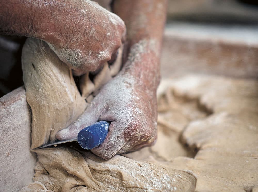 Cutting dough (Photo by Philippe Vaurès Santamaria)