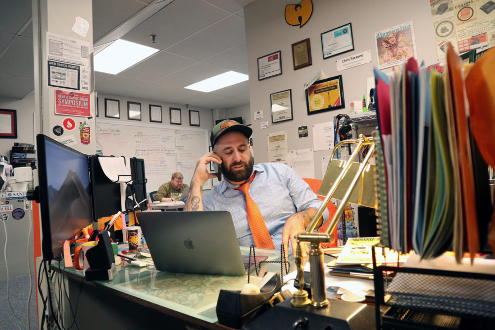 Chris Faraone, edtior-in-chief of DigBoston, in the office with publisher John Loftus. (Adrian Ma/WBUR)