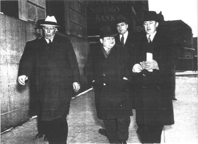 Fred Hull (in light-colored hat) and Harry Luckman (center) turn themselves in to Brooklyn detectives. (Courtesy of Luckman Family)