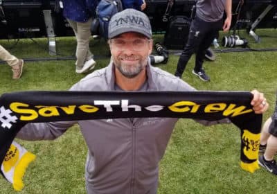Liverpool F.C. manager Jürgen Klopp posing with a Save The Crew scarf at a match in Ann Arbor on July 28, 2018. (Courtesy Save the Crew)