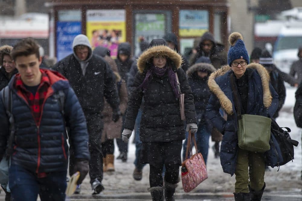 Commuters walk across Boylston St in Copley Sq. (Jesse Costa/WBUR)