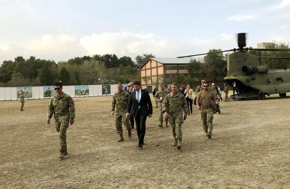 U.S. Defense Secretary Mark Esper, center, walks Gen. Scott Miller, right, chief of the U.S.-led coalition in Afghanistan, at the U.S. military headquarters in Kabul, Afghanistan on Oct. 20. (Lolita C. Balbor/AP)