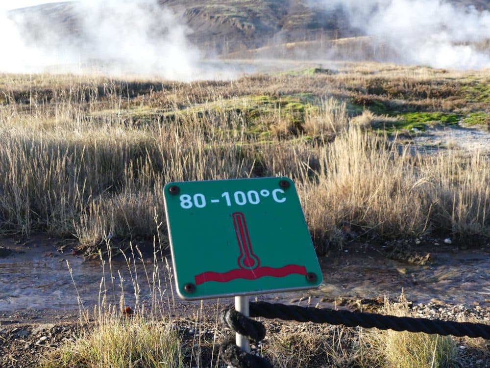 A sign warning tourists to stay away from the boiling water. (Karyn Miller-Medzon/Here & Now)