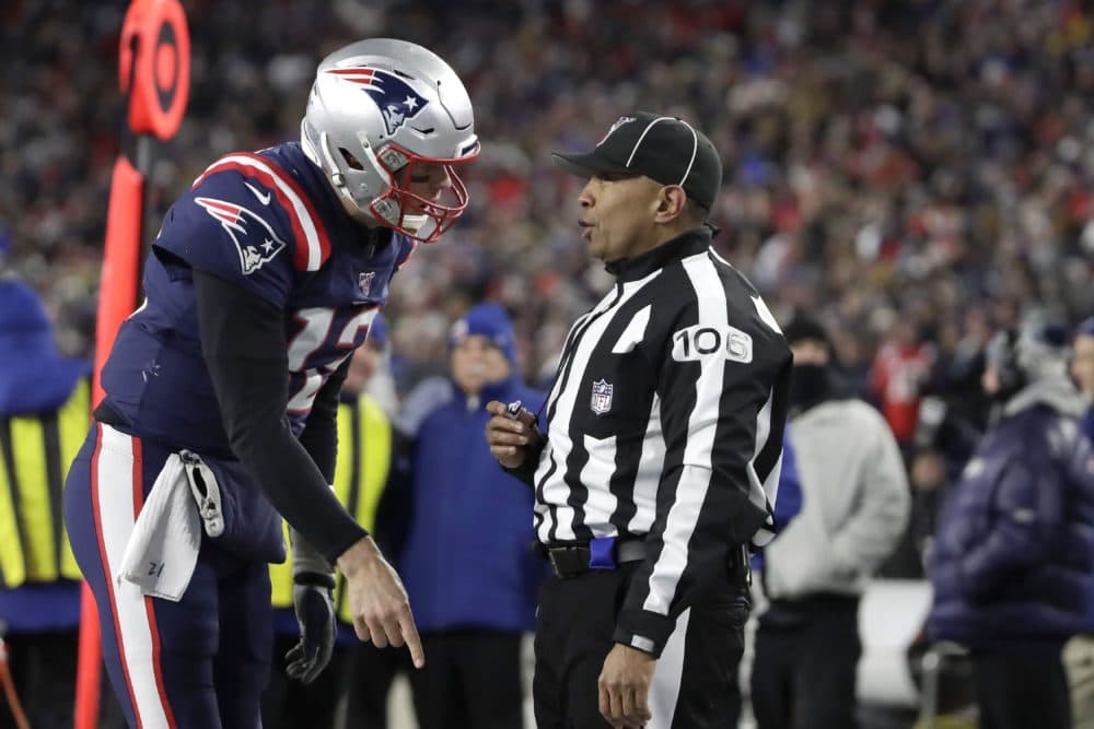 New England Patriots quarterback Tom Brady appeals to down judge Patrick Holt that wide receiver N'Keal Harry had scored a touchdown in the second half of the game against the Kansas City Chiefs on Sunday in Foxborough. Harry was ruled out of bounds before he crossed the goal line. (Elise Amendola/AP)