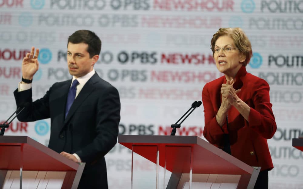 Democratic presidential candidate Sen. Elizabeth Warren, D-Mass., right, speaks beside South Bend Mayor Pete Buttigieg during a Democratic presidential primary debate Thursday, Dec. 19, 2019, in Los Angeles. (Chris Carlson/AP)