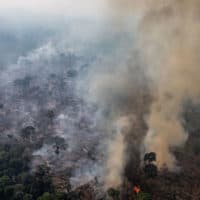 In this aerial image, a fire burns in a section of the Amazon rain forest on August 25, 2019, in the Candeias do Jamari region near Porto Velho, Brazil. (Victor Moriyama/Getty Images)