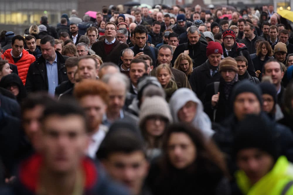 Commuters walk across London Bridge. (Leon Neal/Getty Images)