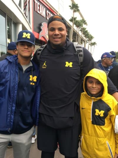 Grant with his two brothers. (Courtesy Newsome family)