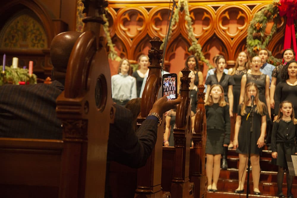 Former Boston Children's Theatre members sing at their final concert in early December. (OJ Slaughter for WBUR)