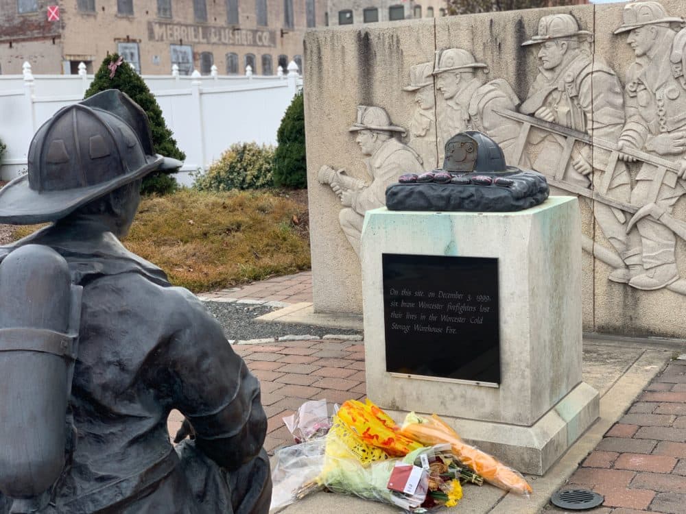 The monument dedicated to the Worcester SIx now stands at the site of the Worcester Cold Storage & Warehouse Co. building. The land is now home to a fire station. (Simón Rios/WBUR)