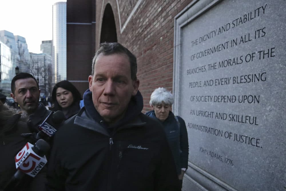 Harvard University professor Charles Lieber leaves the Moakley Federal Courthouse with his wife Jennifer, right, in Boston. (Charles Krupa/AP)