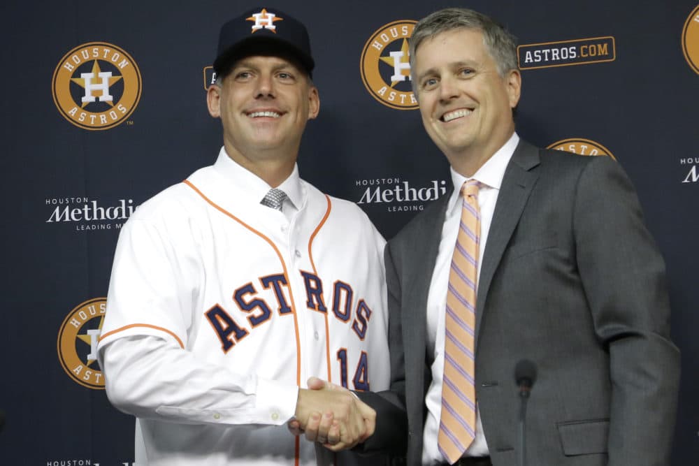 In this Sept. 29, 2014, file photo, Houston Astros general manager Jeff Luhnow, right, and A.J. Hinch pose after Hinch is introduced as the new manager of the baseball club in Houston. Hinch and Luhnow were fired Monday, Jan. 13, 2020, after being suspended for their roles in the team's extensive sign-stealing scheme from 2017. (Pat Sullivan/AP)