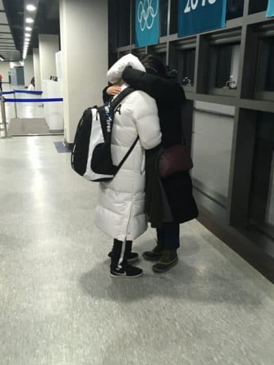 Grace Lee hugs her mother, Eliza, after Korea's 8-0 loss to Sweden. (Courtesy Seth Berkman)