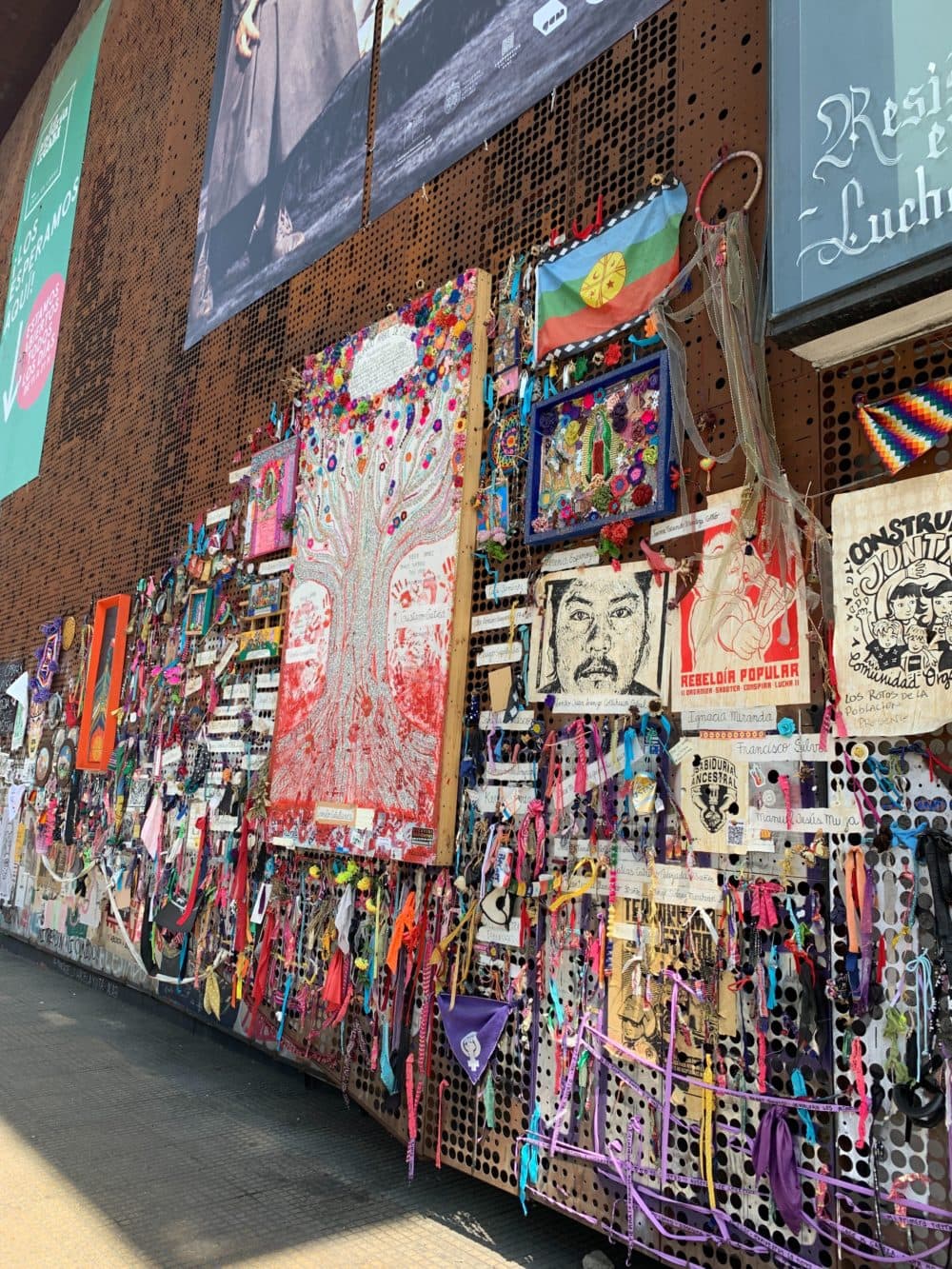 Protest art on the exterior wall of the Gabriela Mistral Cultural Center in Santiago. (Amelia Mason/WBUR)