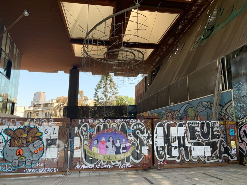 Protest art outside the Gabriela Mistral Cultural Center in Santiago. (Amelia Mason/WBUR)