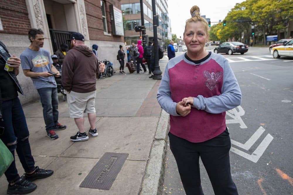Janine Day stands outside Boston Health Care for the Homeless Program. (Jesse Costa/WBUR)