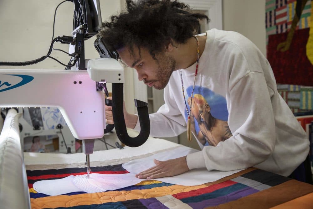 Michael Thorpe works on a self-portrait in his studio. (Robin Lubbock/WBUR)