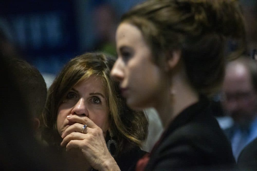 A woman listens intently to presidential candidate Bernie Sanders during a speech given at St. Anselm College in Manchester, NH on February 7, 2020. (Jesse Costa/WBUR)