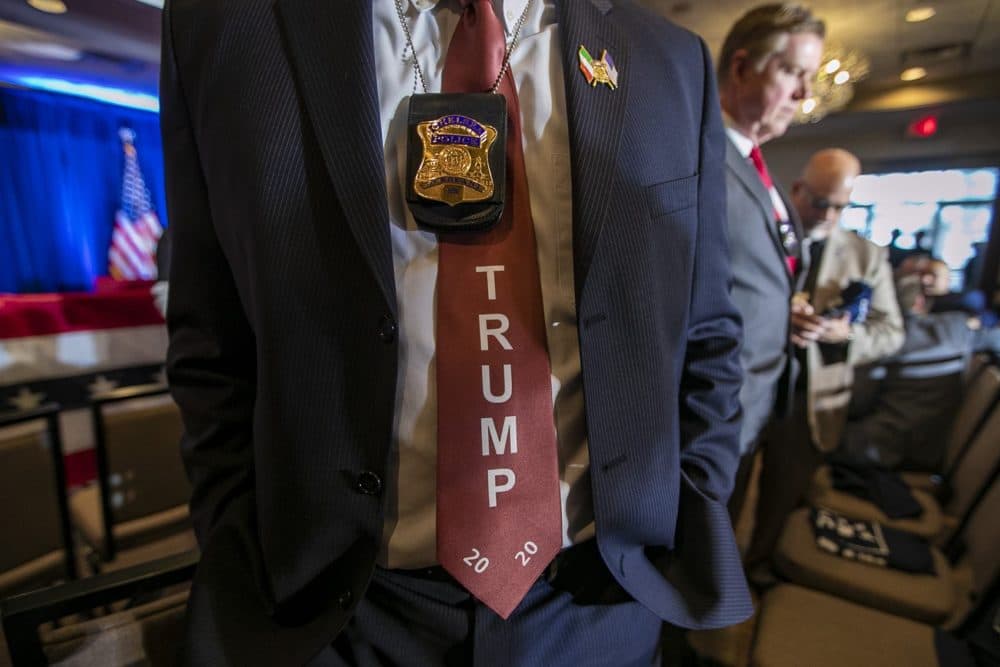 Police officer Joe Bevere wears a Trump campaign tie at the Cops For Trump event with Mike Pence in Portsmouth, NH. (Jesse Costa/WBUR)