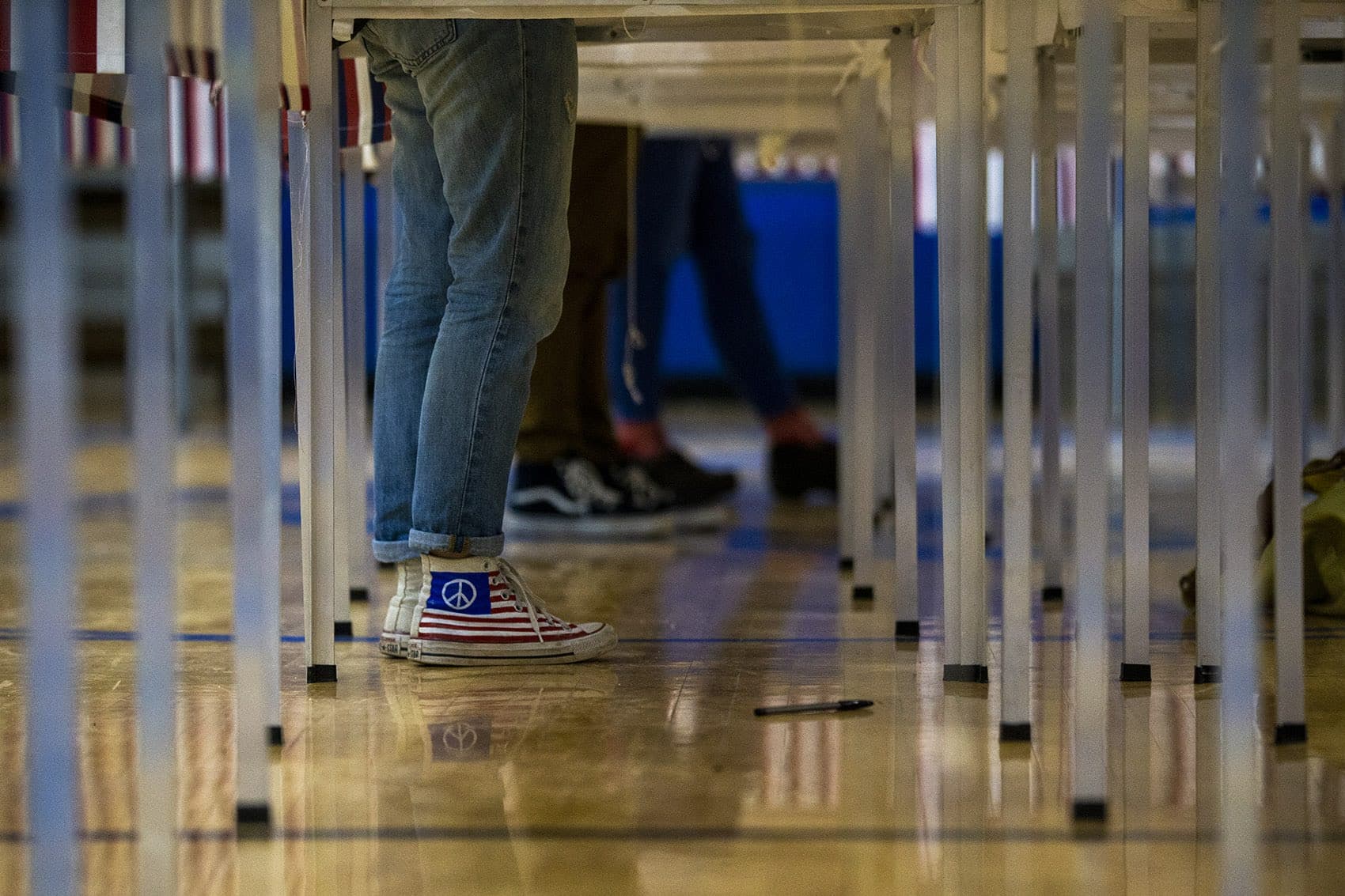 A University of New Hampshire student votes at the polls at Oyster River High School in Durham, N.H. (Jesse Costa/WBUR)