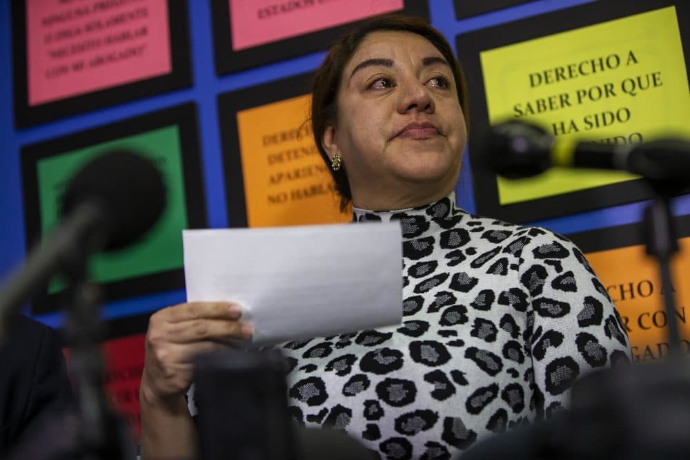 Ms. Vasquez’s eyes well up with tears as she describes to reporters the incident in which she and her 15-year-old daughter were violently assaulted on Feb. 15 by two white women near Maverick Station in East Boston. (Jesse Costa/WBUR)
