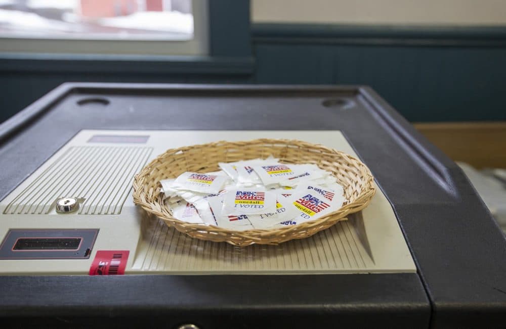 Stickers on top of a voting machine at a polling place in Concord, New Hampshire. (Joe Difazio for WBUR)