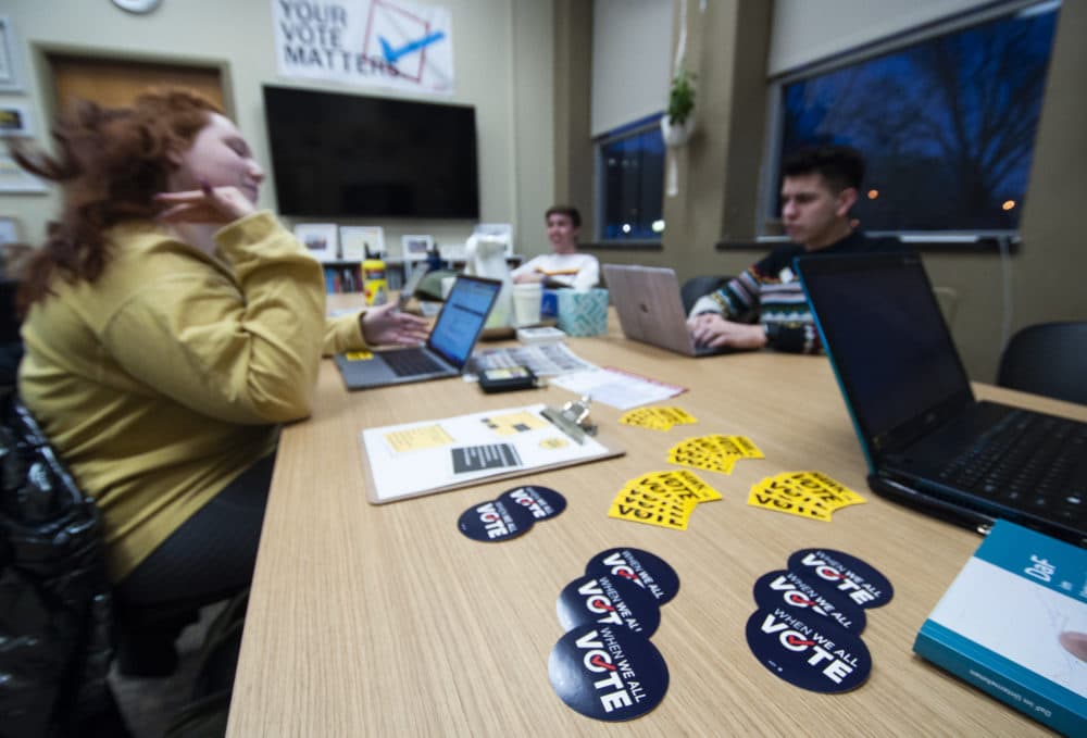 Members of Hawk the Vote, a nonpartisan group to increase youth turnout in the 2020 elections and Iowa caucuses at the University of Iowa hold a Q&A session about the upcoming caucuses in Iowa City. (Chris Bentley/Here & Now)