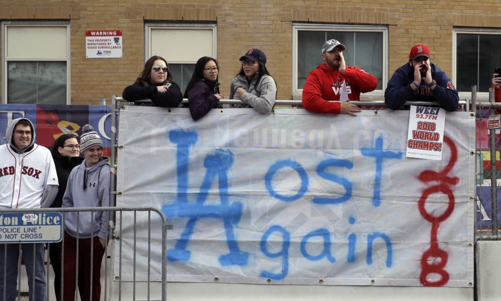 Boston Red Sox fans line the parade route, waiting to celebrate the team's World Series championship over the Los Angeles Dodgers, Oct. 31, 2018, in Boston. (Charles Krupa/AP)