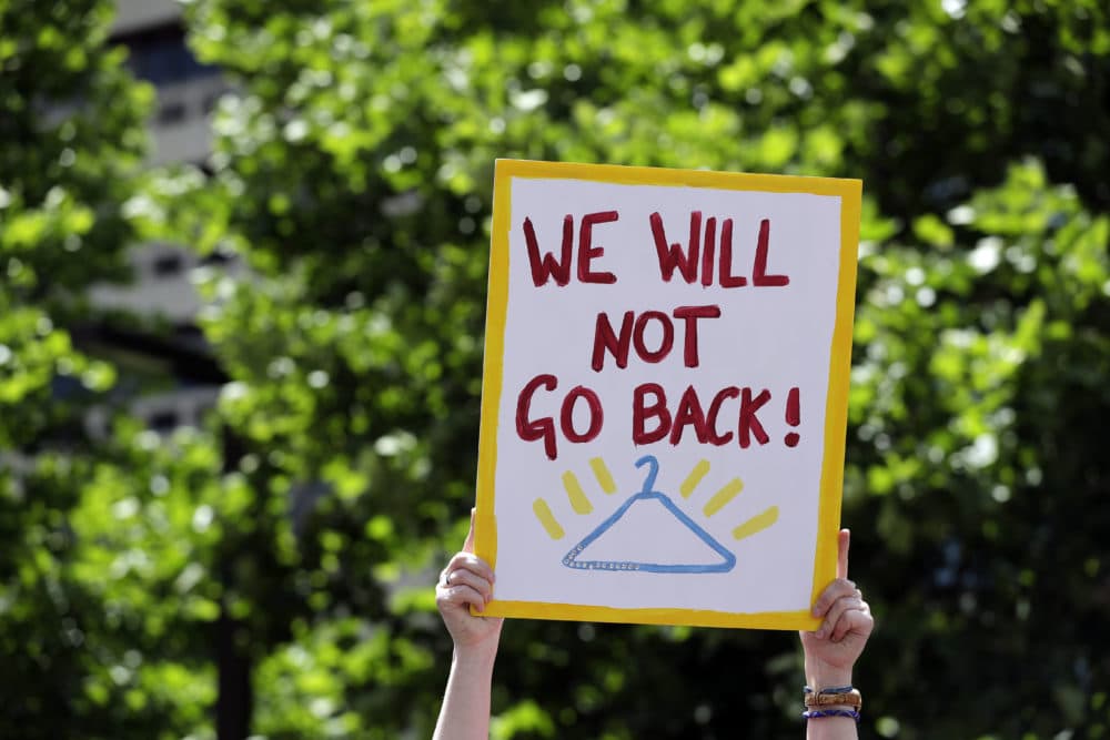 Abortion-rights supporters take part in a protest May 30, 2019, in St. Louis. A St. Louis judge heard an hour of arguments Thursday on Planned Parenthood's request for a temporary restraining order that would prohibit the state from allowing the license for Missouri's only abortion clinic to lapse at midnight Friday. (Jeff Roberson/AP)