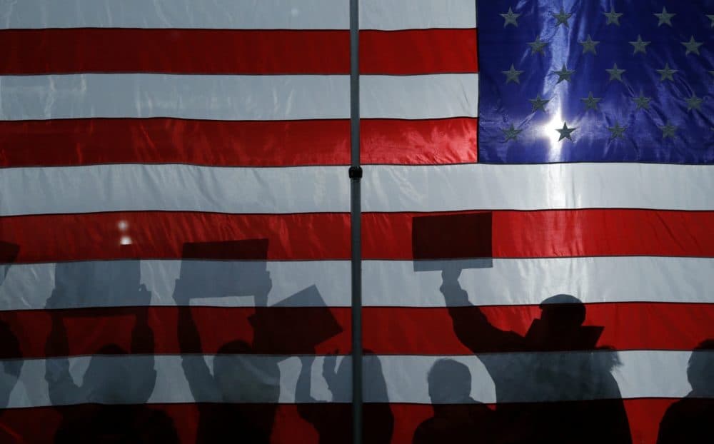 In this Jan. 26, 2020, file photo, people cheer as democratic presidential candidate Sen. Bernie Sanders, I-Vt., speaks at a campaign rally in Sioux City, Iowa. (John Locher/AP)