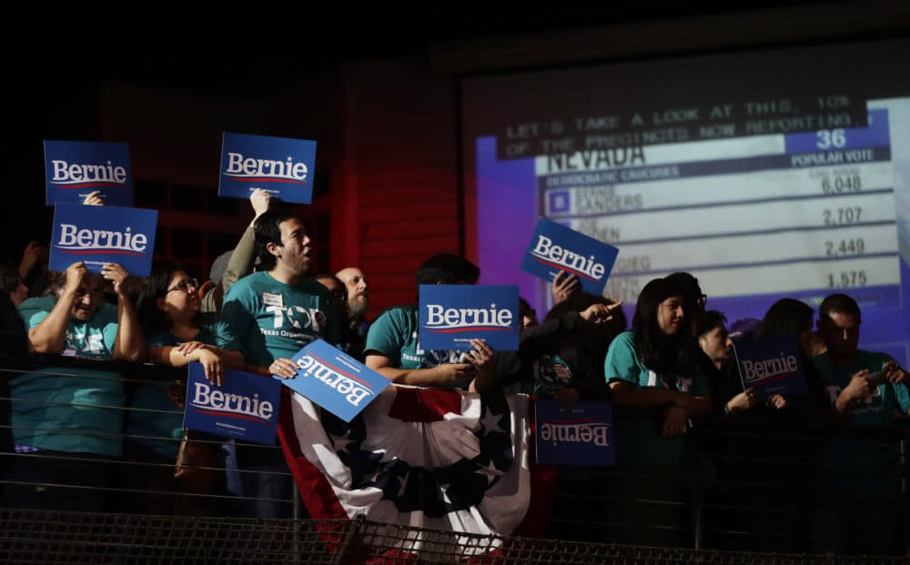 Supporters of Democratic presidential candidate Sen. Bernie Sanders, I-Vt., cheer as they watch results of the Nevada Cacus during a campaign event in San Antonio, Saturday, Feb. 22, 2020. (AP Photo/Eric Gay)