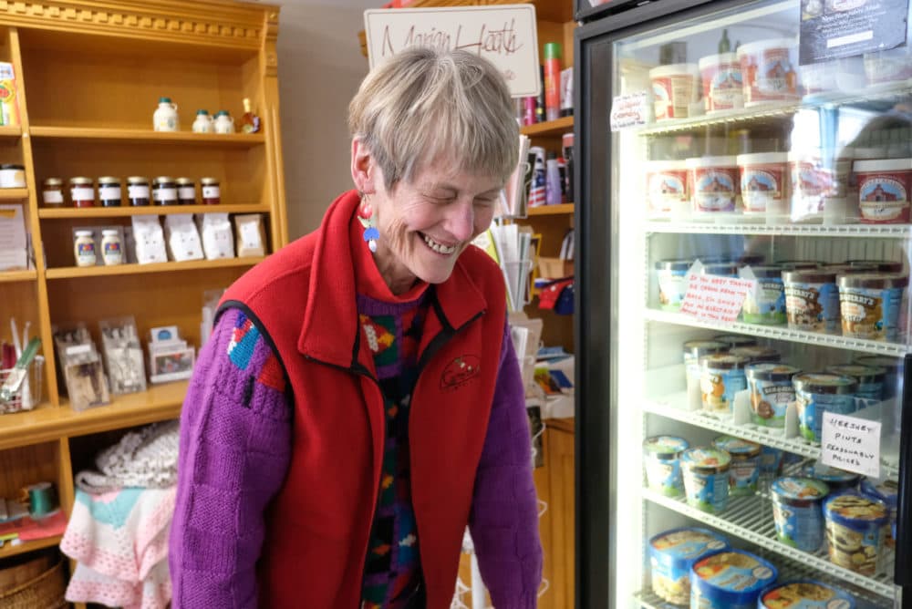 Toni Halla laughing inside the Canterbury Country Store. (Jill Ryan/Here & Now)
