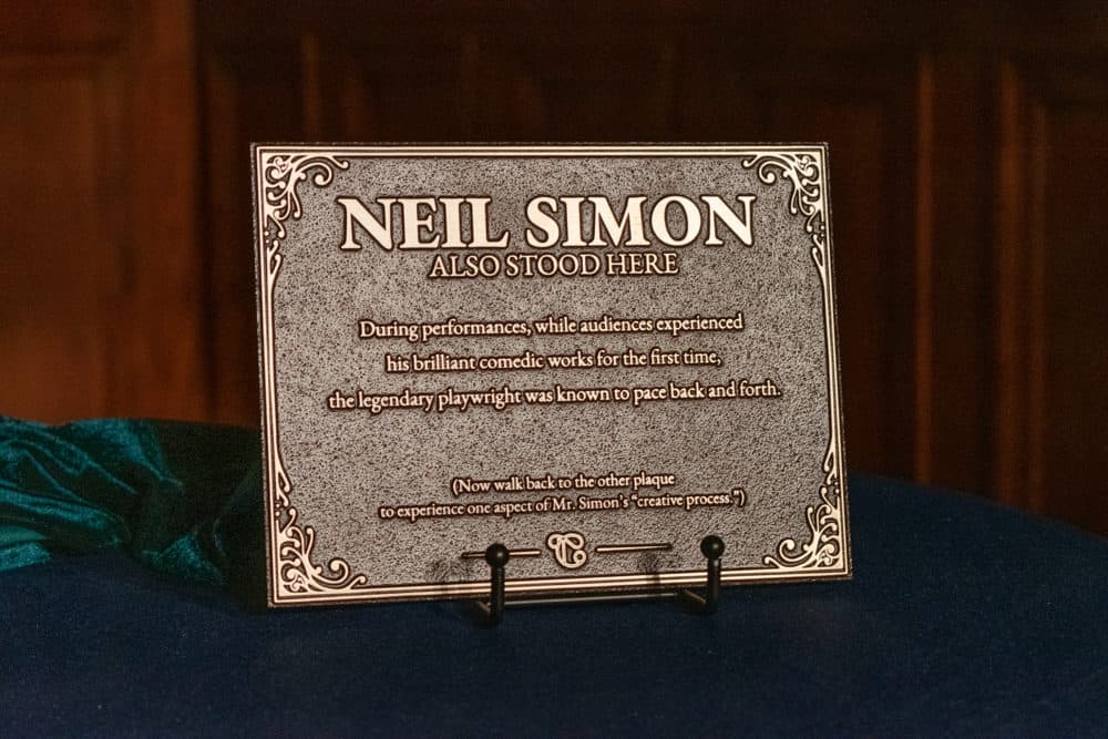One of two plaques honoring playwright Neil Simon at the Emerson Colonial Theatre in Boston. (Allison Hagan/Here & Now)