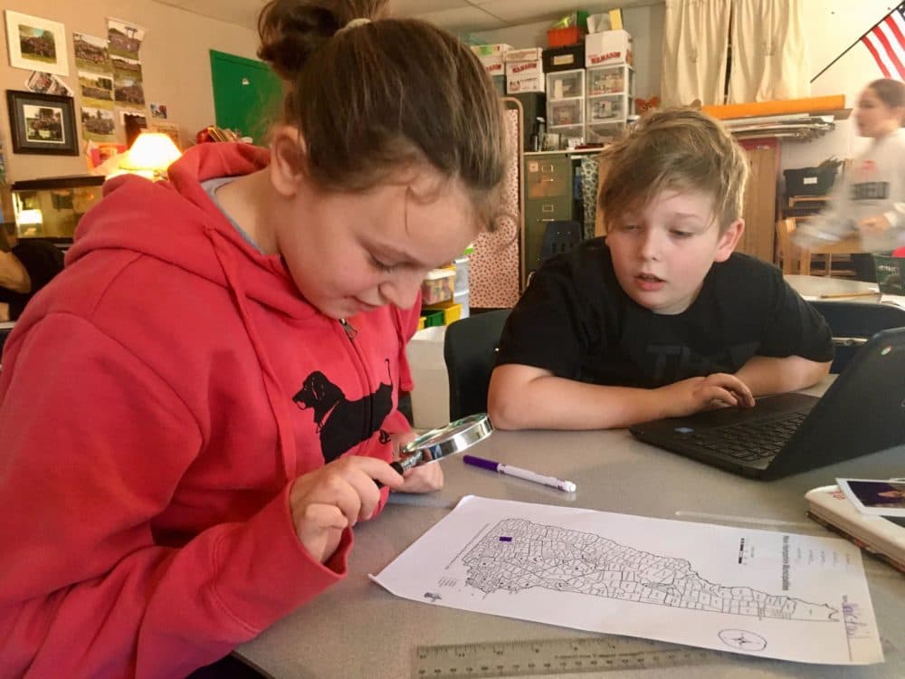 Natalie Guice (right) mapping out diners in New Hampshire. She says learning about how the primary works has made her excited to meet candidates and vote when she turns 18. (Sarah Gibson/NHPR)