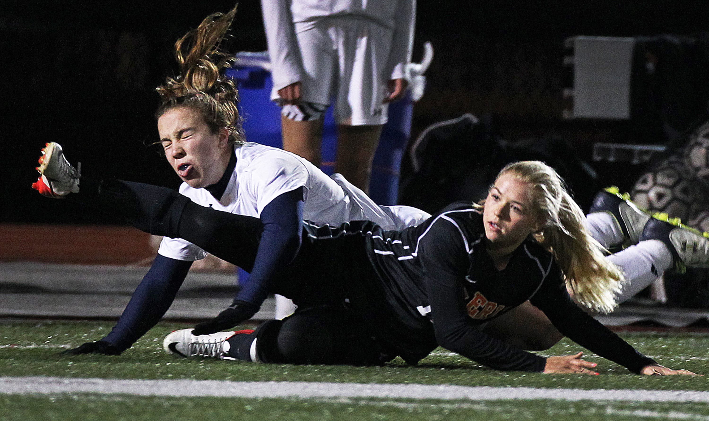Kristi Kirshe, top, collides with an opponent during a high school soccer tournament. (Jim Davis/The Boston Globe via Getty Images)